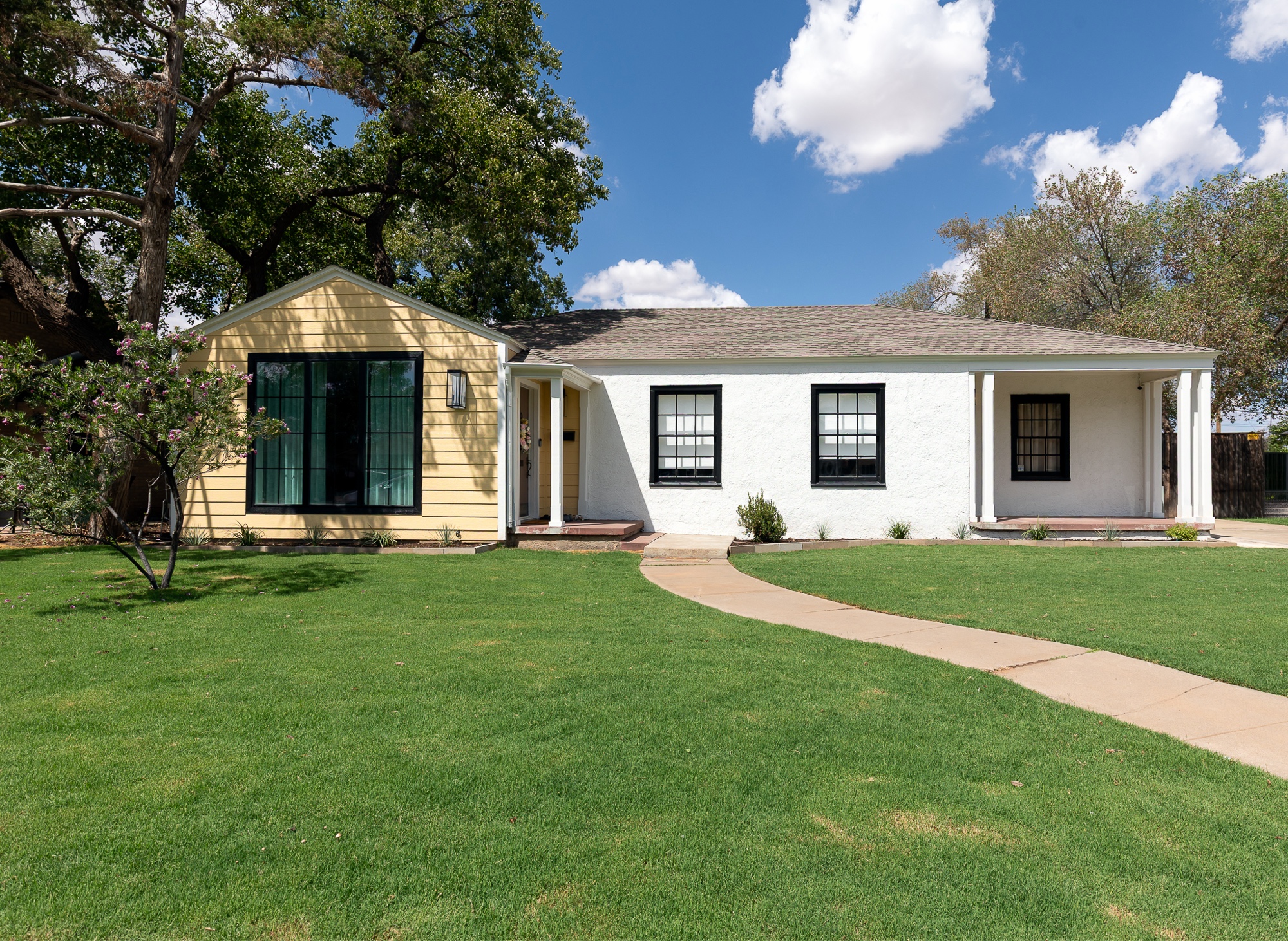Tech Terrace cottage exterior with mature trees