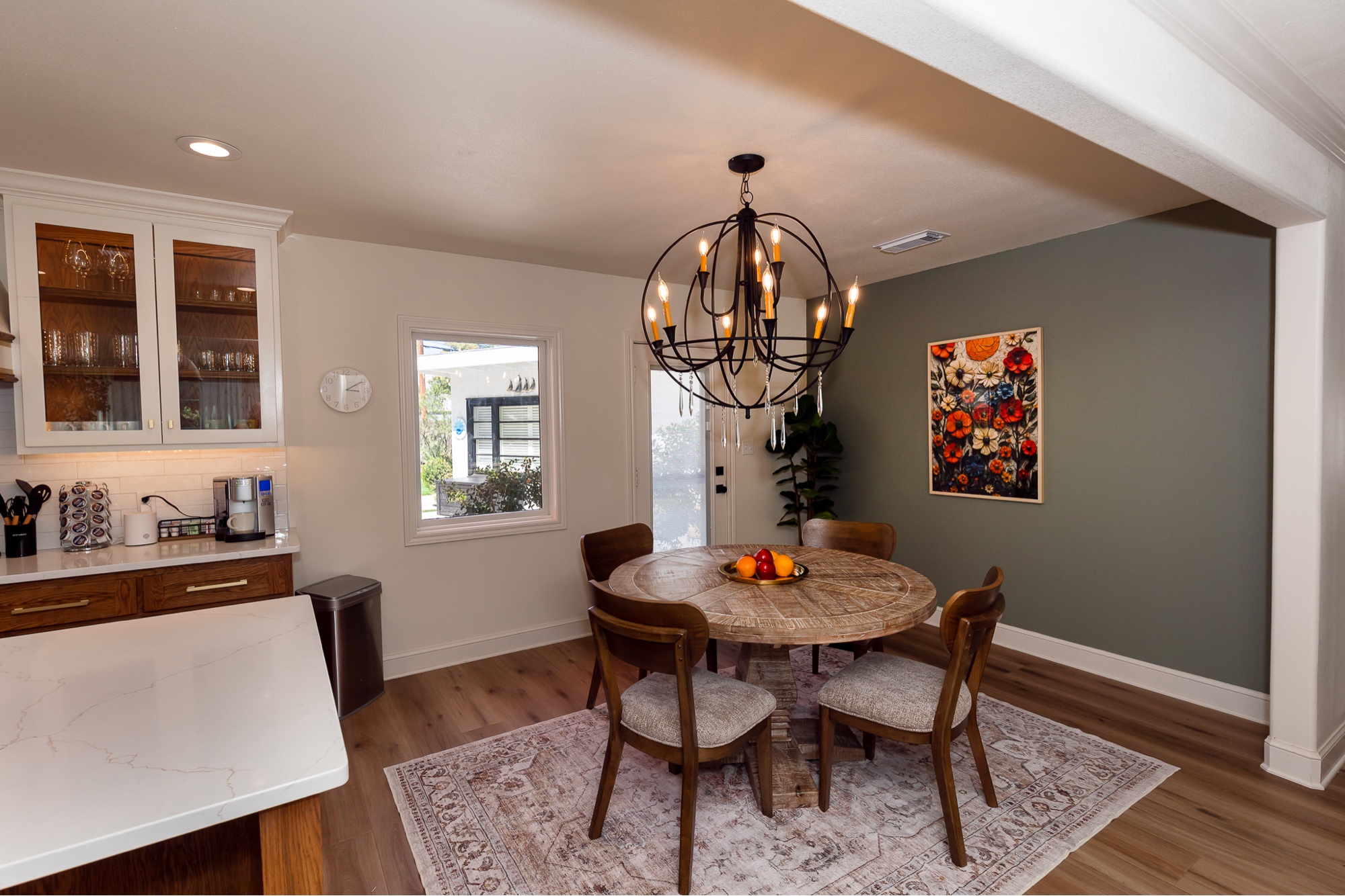Dining room with orb chandelier and round table