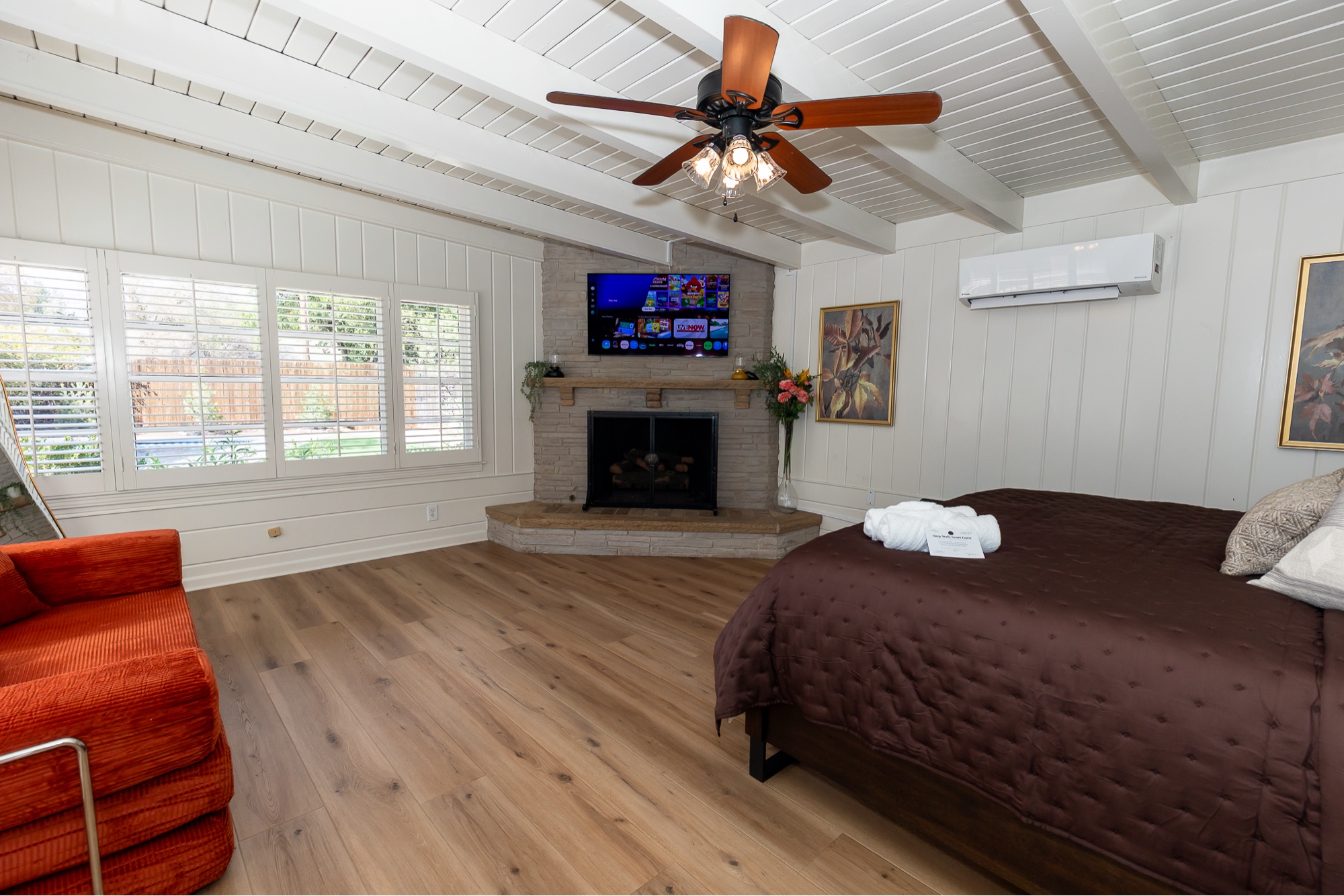 Primary bedroom with corner gas fireplace